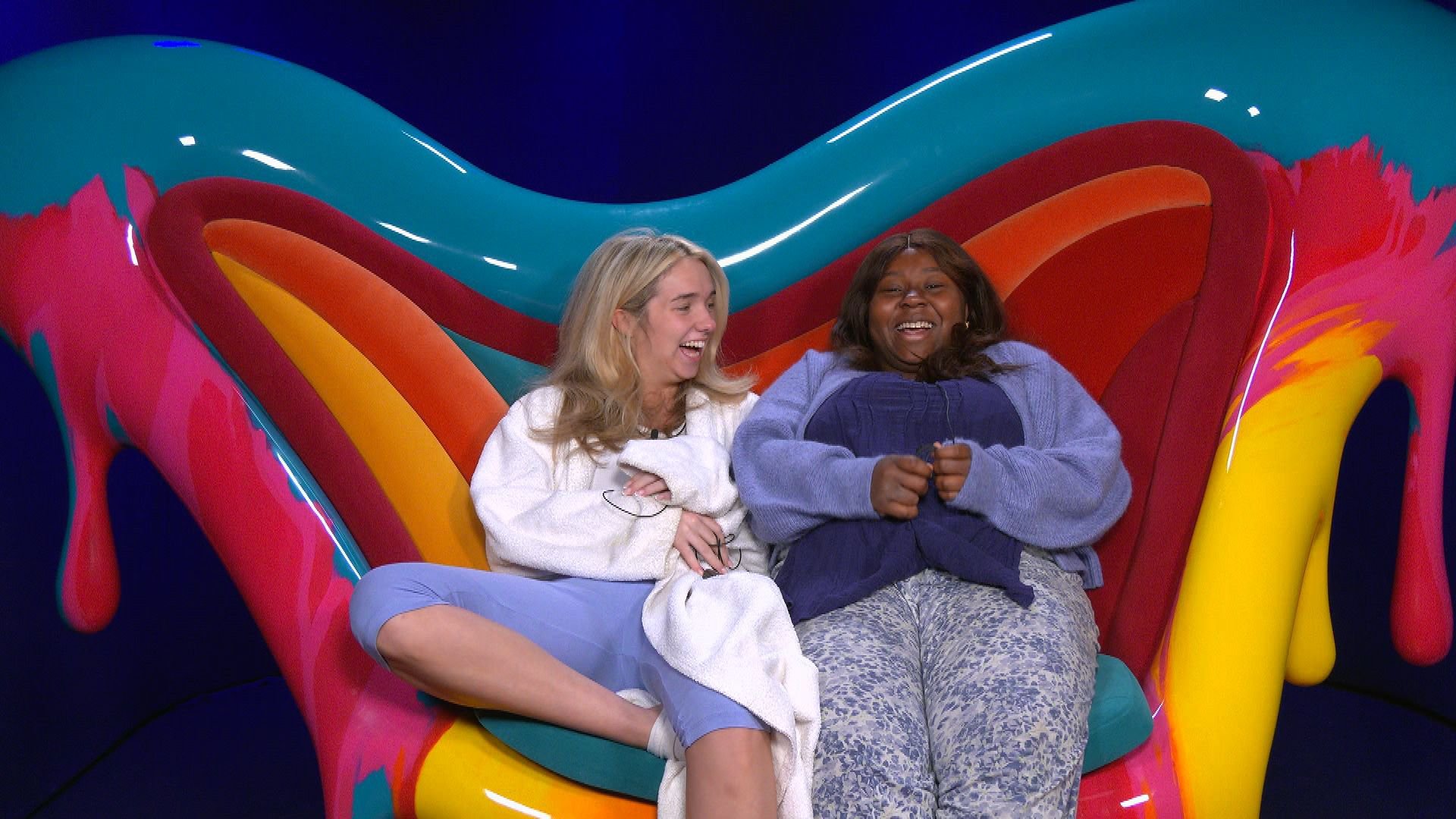 Big Brother star Daze sat with Lily on the blue, pink, red, orange and yellow diary room chair